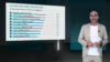 Ausschnitt aus dem Erklärvideo zu den Ergebnissen der LA-MED Facharzt-Studie 2026, Thema: LpA in allen Fachgruppen. Ein Moderator steht in einem von KI konstruierten virtuellen Fernsehstudio, hinter sich ein Bildschirm mit eingeblendeten Balkendiagrammen.